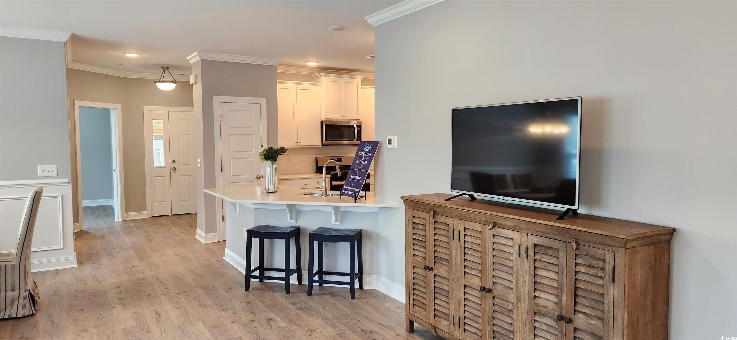 1407 Gooseneck Place, Unit 102 Murrells Inlet, SC 29576 - Photo 16 of 39 Living room with light hardwood / wood-style floor