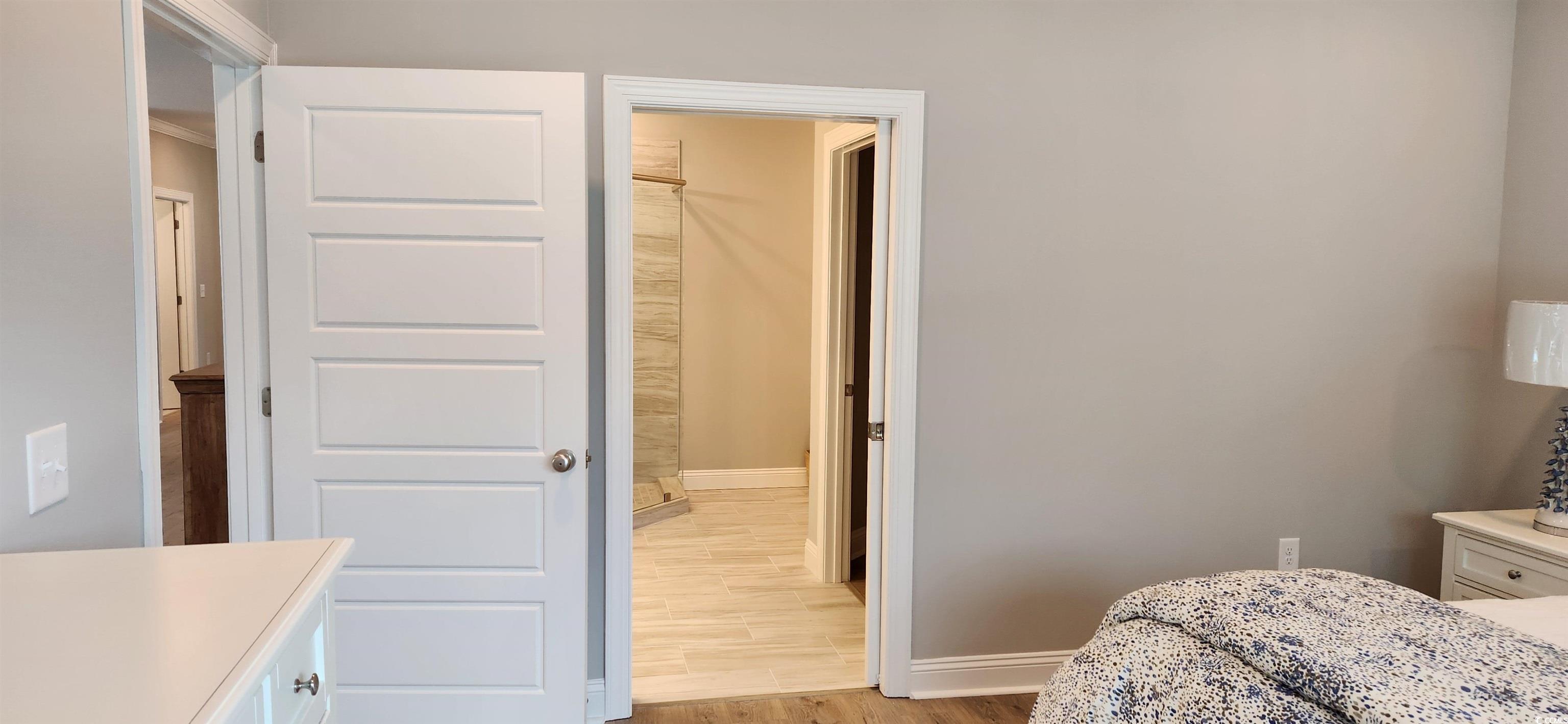 1407 Gooseneck Place, Unit 102 Murrells Inlet, SC 29576 - Photo 22 of 39 Bedroom featuring light wood-type flooring
