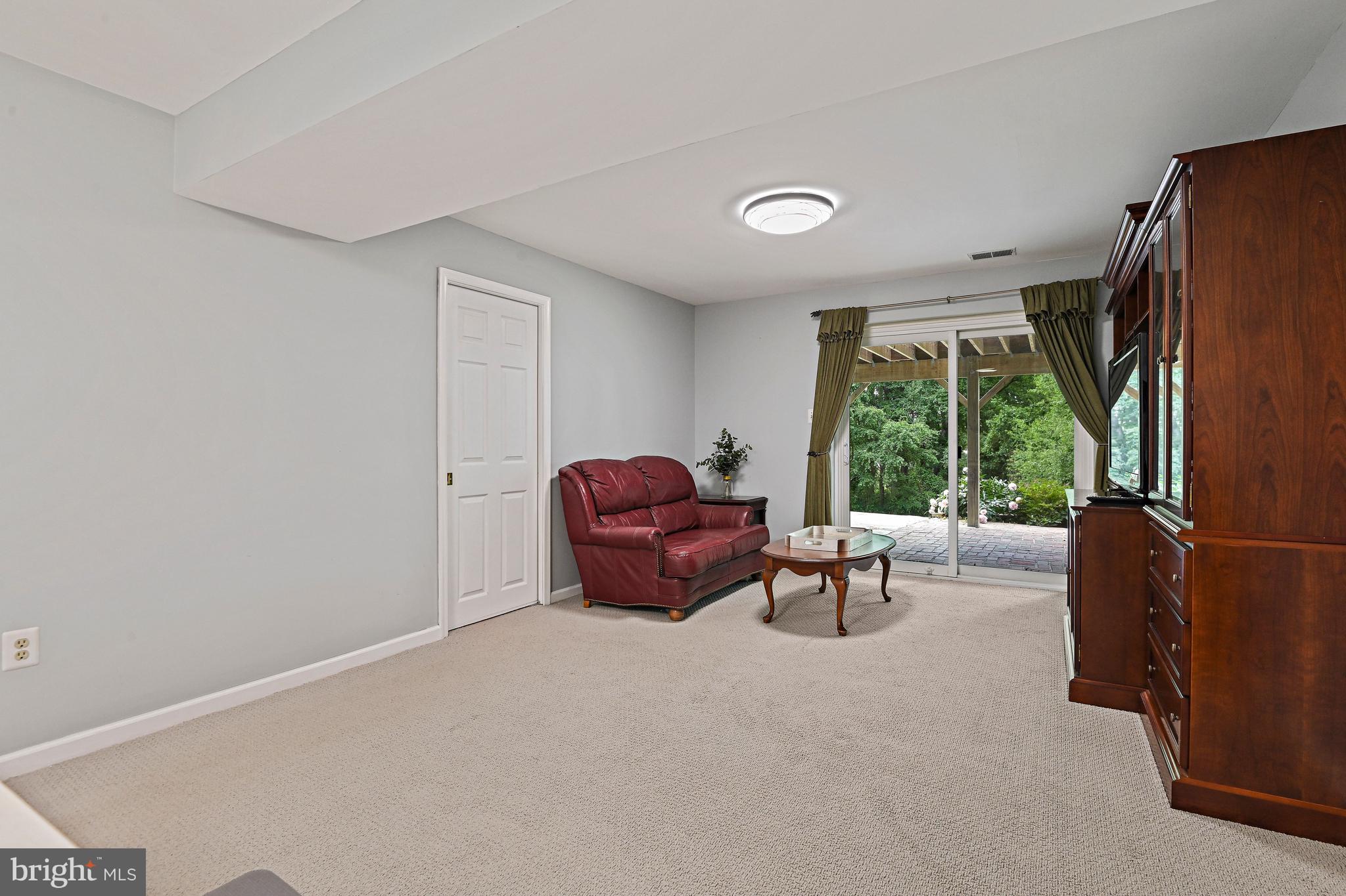 9830 Faust Drive Vienna, VA 22182 - Photo 57 of 75 Lower level den with sliding doors to patio