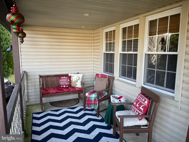 a outdoor living space with furniture and a potted plant