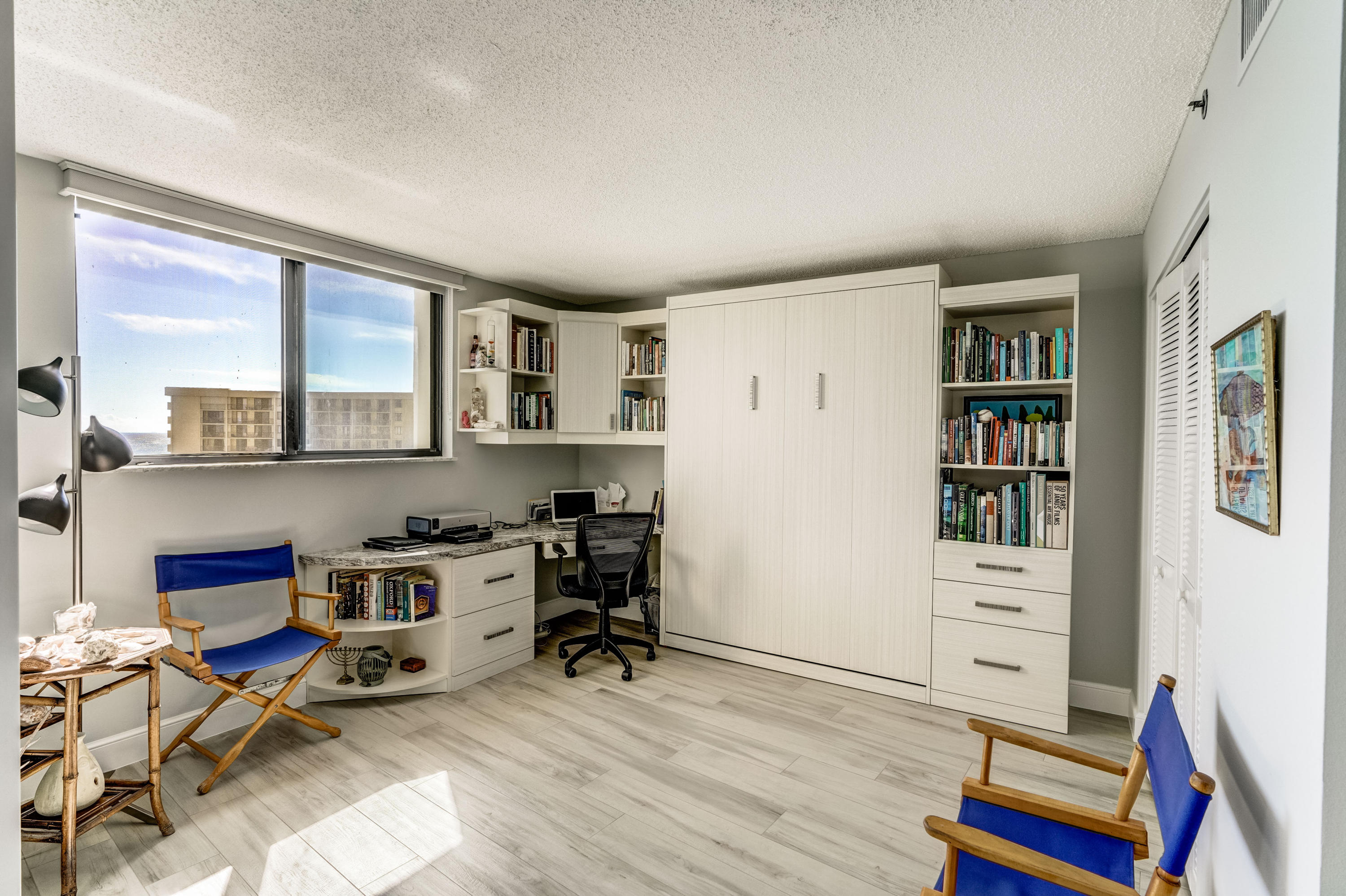 200 Ocean Trail Way, Unit 1107 Jupiter, FL 33477 - Photo 13 of 29 a room with furniture a rug and a window