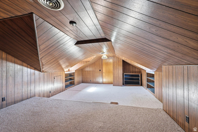 292 West 400 South Springville, UT 84663 - Photo 16 of 37 Carpeted attic space featuring wood-finish wall and ceiling paneling