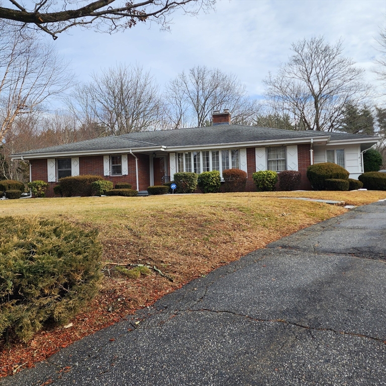 183 Lebanon Hill Road Southbridge, MA 01550 - Photo 1 of 40 a front view of a house with a yard and trees