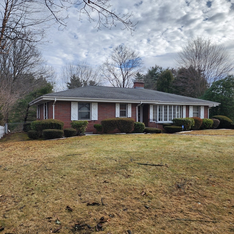183 Lebanon Hill Road Southbridge, MA 01550 - Photo 2 of 40 a front view of a house with a yard table and chairs