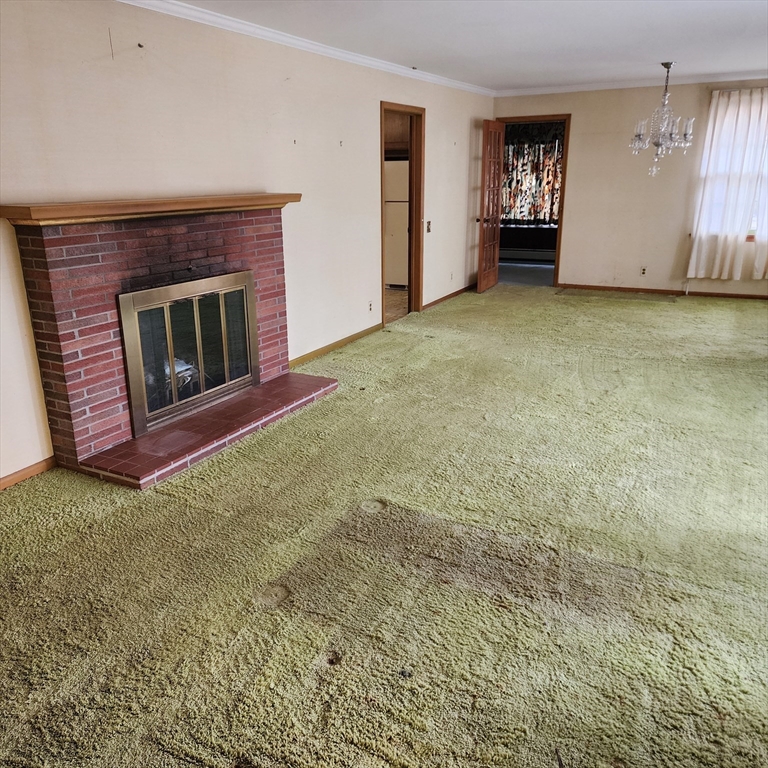183 Lebanon Hill Road Southbridge, MA 01550 - Photo 21 of 40 an empty room with windows and fireplace