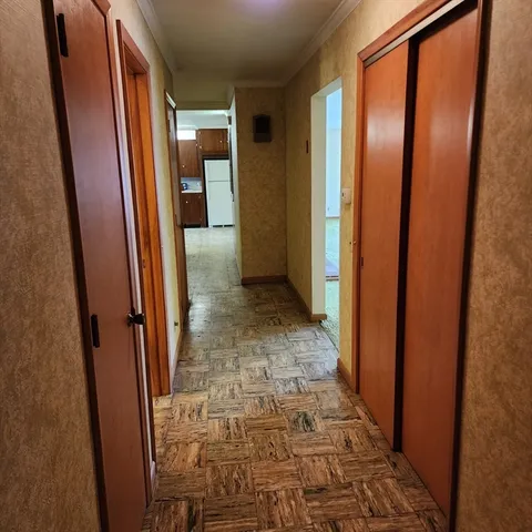a view of an empty room with a fireplace