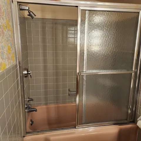 a view of a room with walk in closet and wooden floor