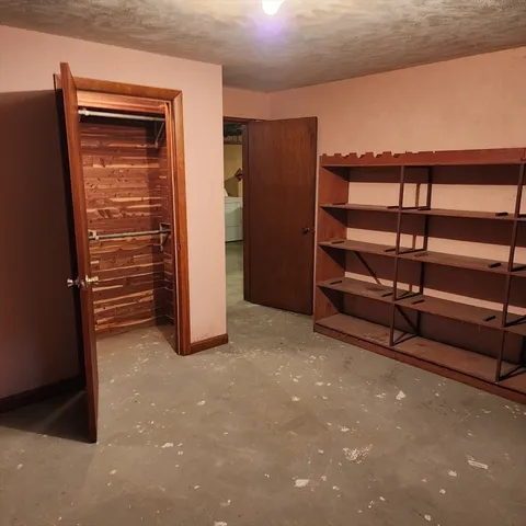 a view of an empty room with stairs