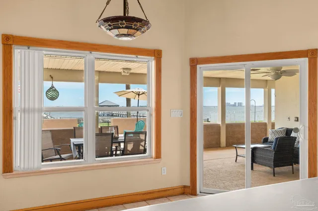 a view of a house with garden and a pond