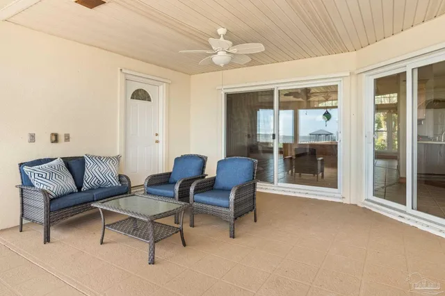 a view of a house with palm trees
