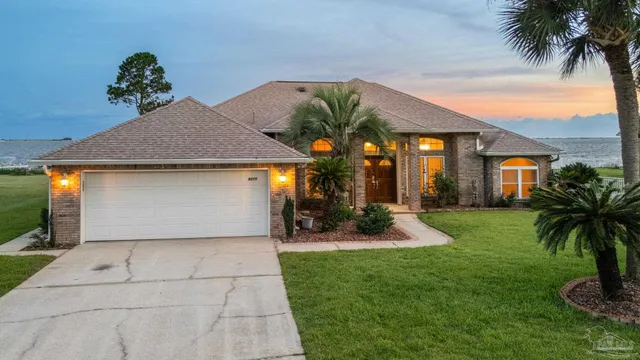 a swimming pool with outdoor seating and yard