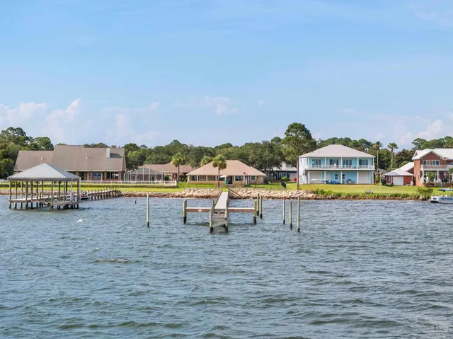 a view of a terrace with lawn chairs