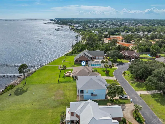 a bird view of house with outdoor space and seating