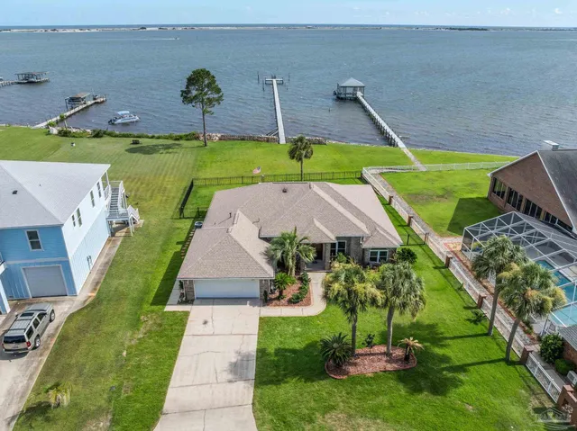 an aerial view of a house with a garden and plants