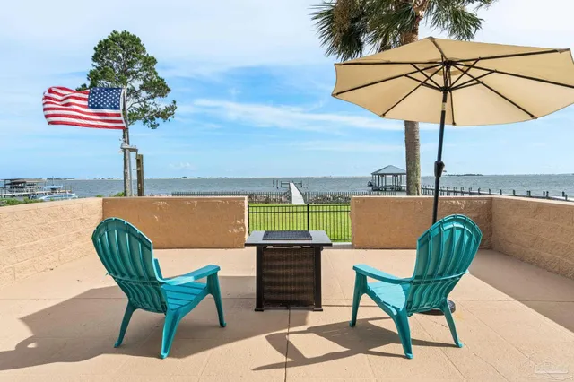 a view of a chairs and table in the terrace