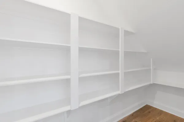a view of an empty walk in closet