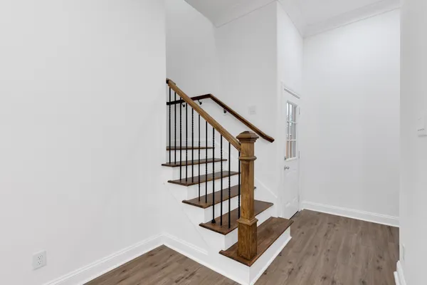 a view of entryway with wooden floor