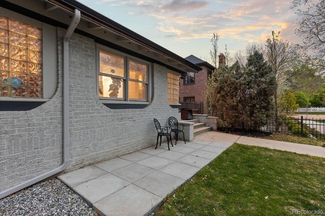 a view of a backyard with sitting area