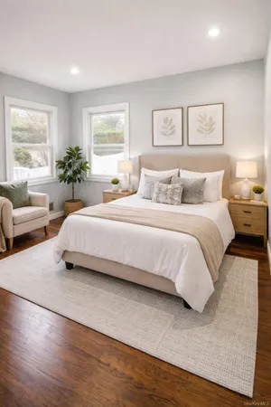 a bedroom with a bed and glass window