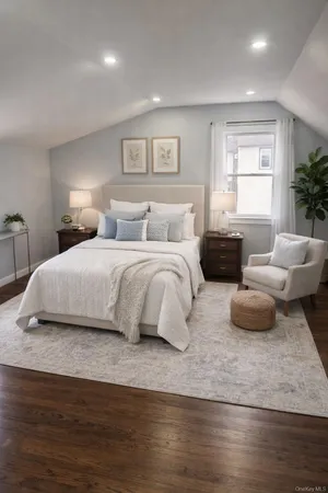 a bedroom with a bed and a couch