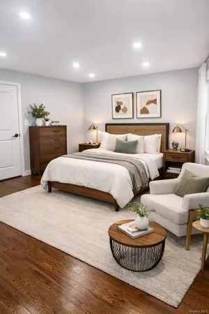 a spacious bedroom with a bed and a couch