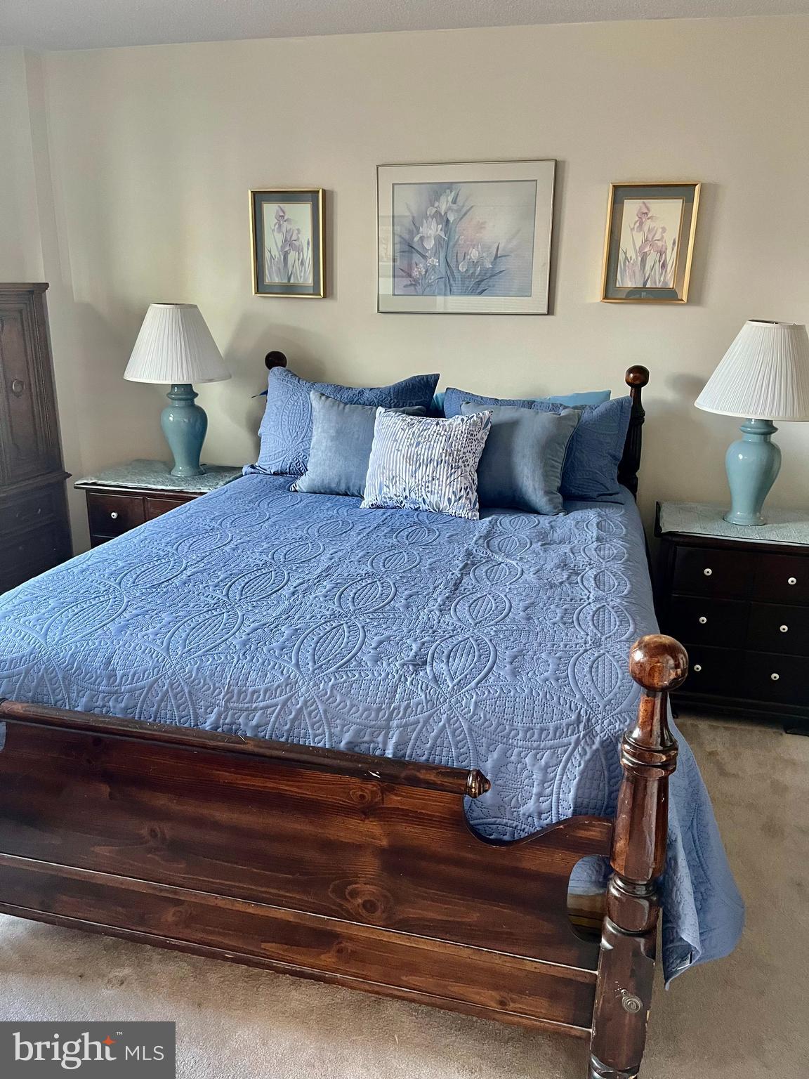 1808 Old Meadow Road, Unit 1104 McLean, VA 22102 - Photo 20 of 35 a bedroom with a bed and wooden floor