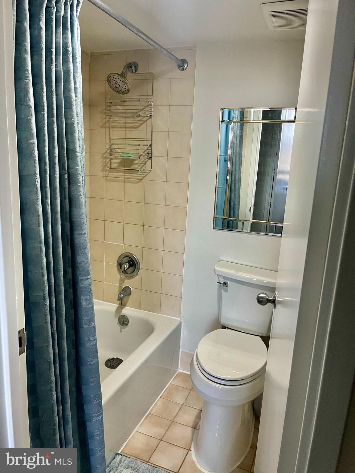 1808 Old Meadow Road, Unit 1104 McLean, VA 22102 - Photo 24 of 35 a bathroom with a toilet and shower