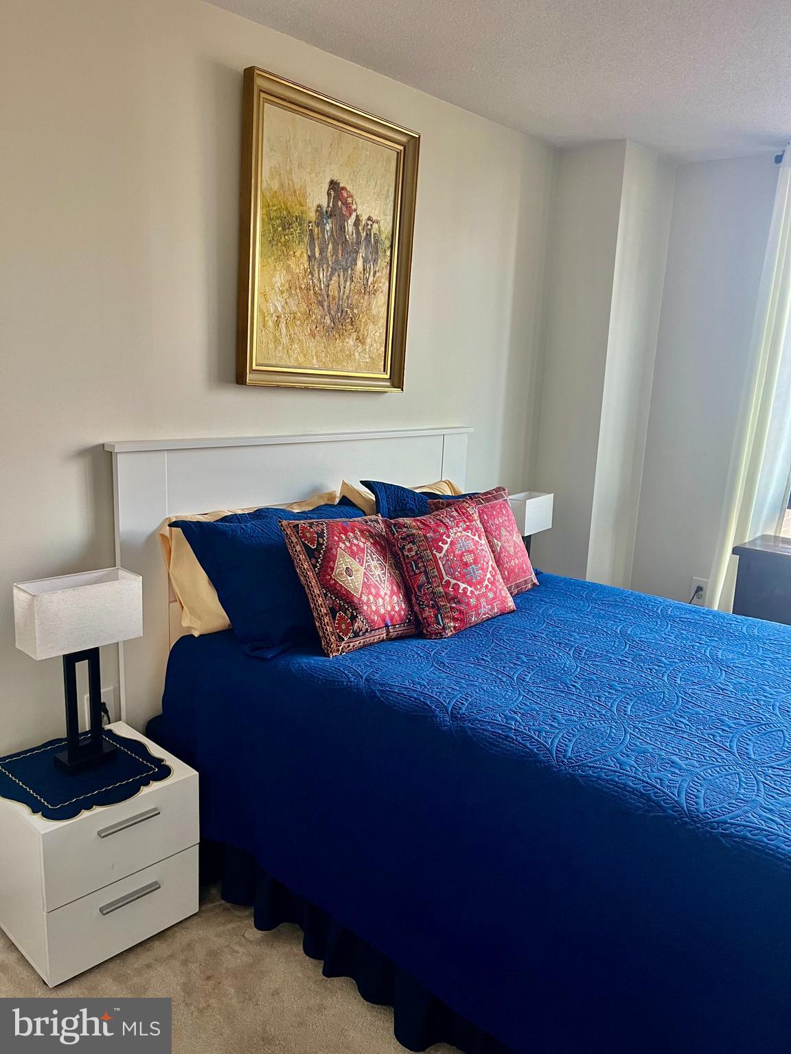 1808 Old Meadow Road, Unit 1104 McLean, VA 22102 - Photo 26 of 35 a bedroom with a bed and a painting on the wall