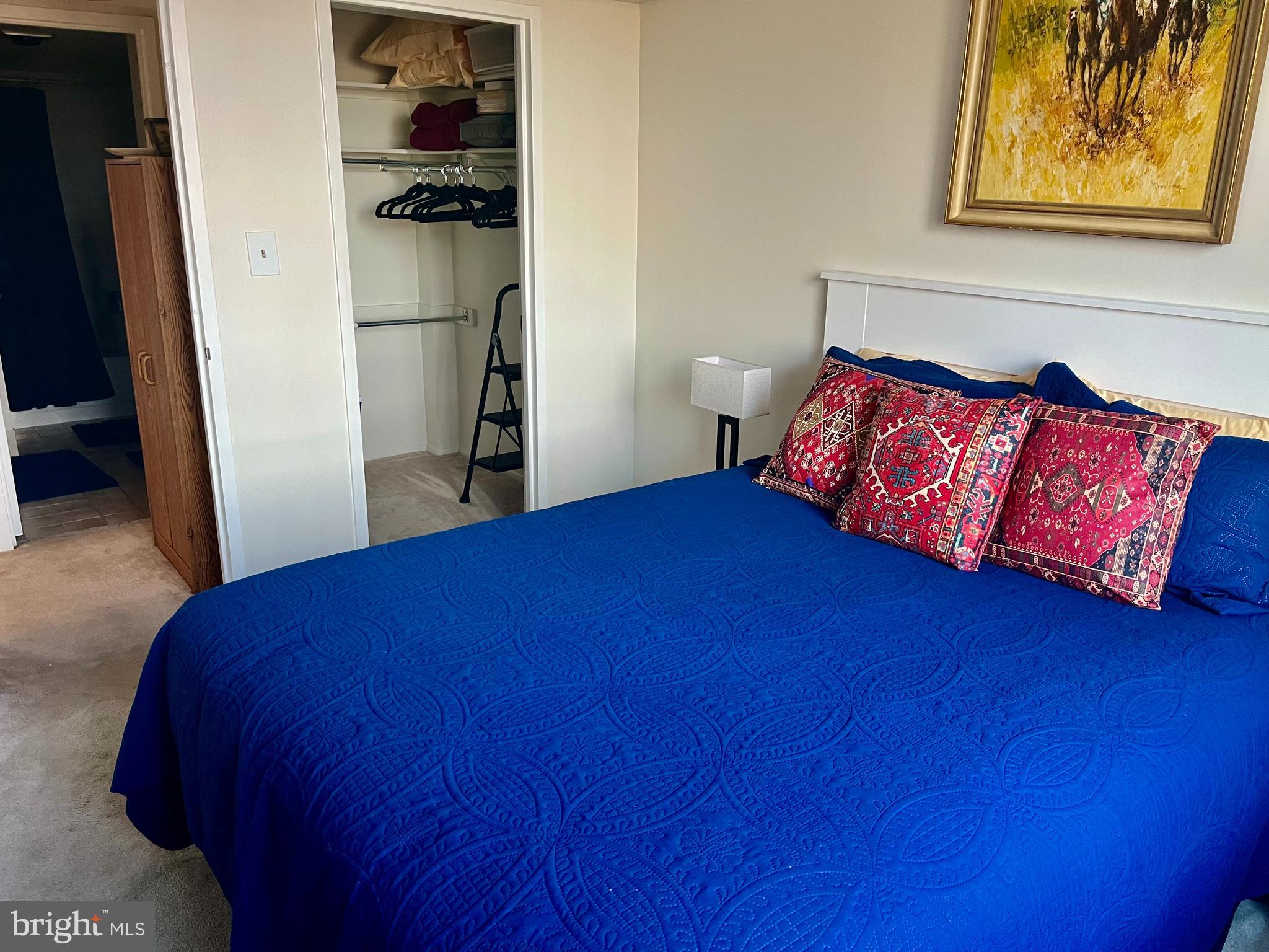 1808 Old Meadow Road, Unit 1104 McLean, VA 22102 - Photo 27 of 35 a bed sitting in a bedroom next to a window