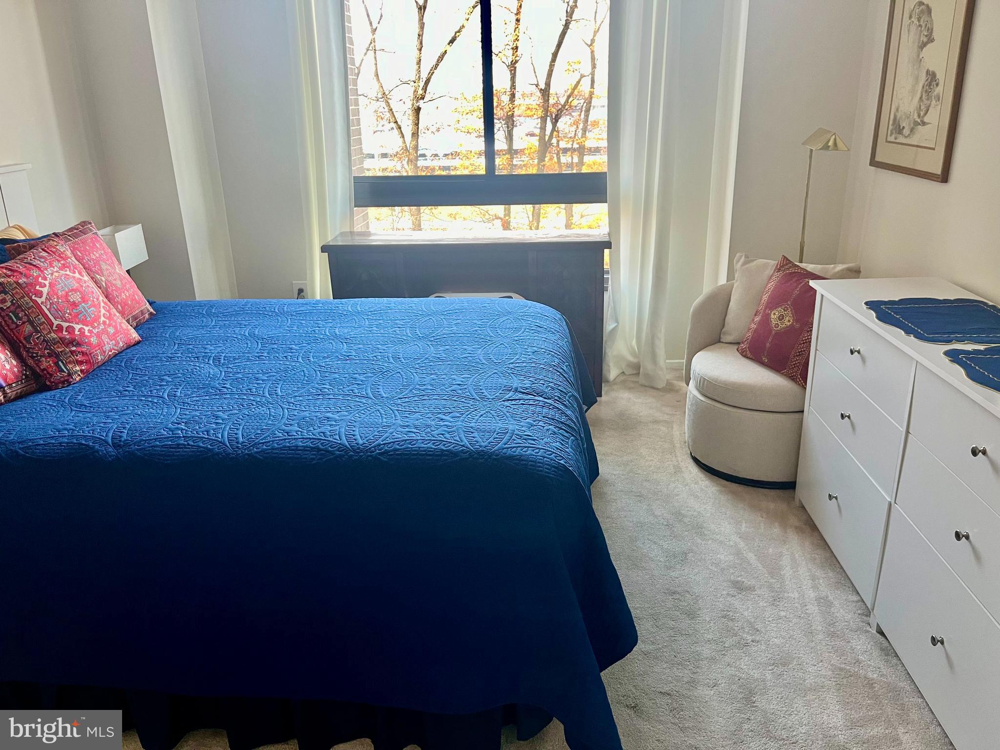 1808 Old Meadow Road, Unit 1104 McLean, VA 22102 - Photo 28 of 35 a bedroom with a bed and a couch