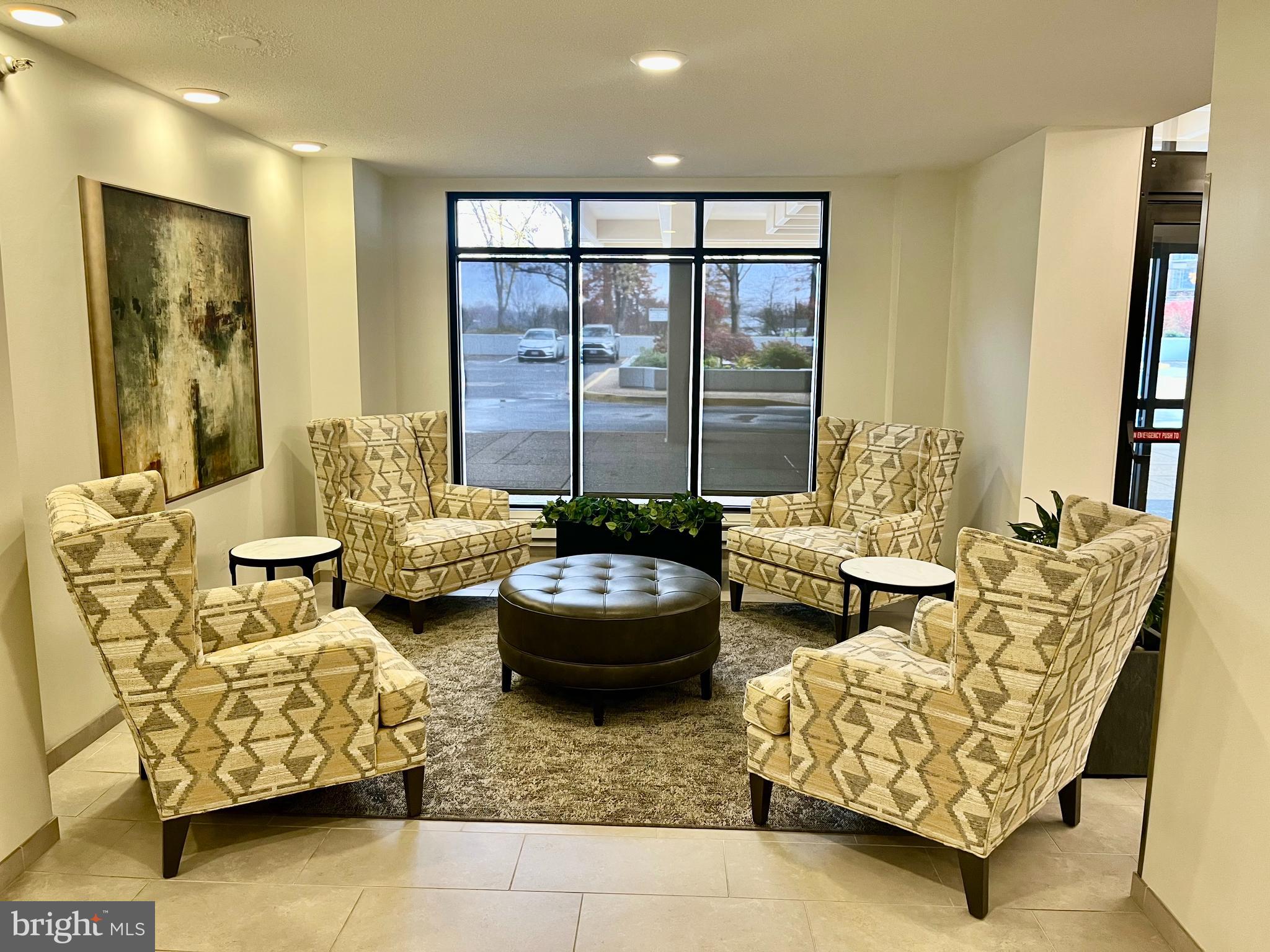 1808 Old Meadow Road, Unit 1104 McLean, VA 22102 - Photo 5 of 35 a living room with furniture and a large window