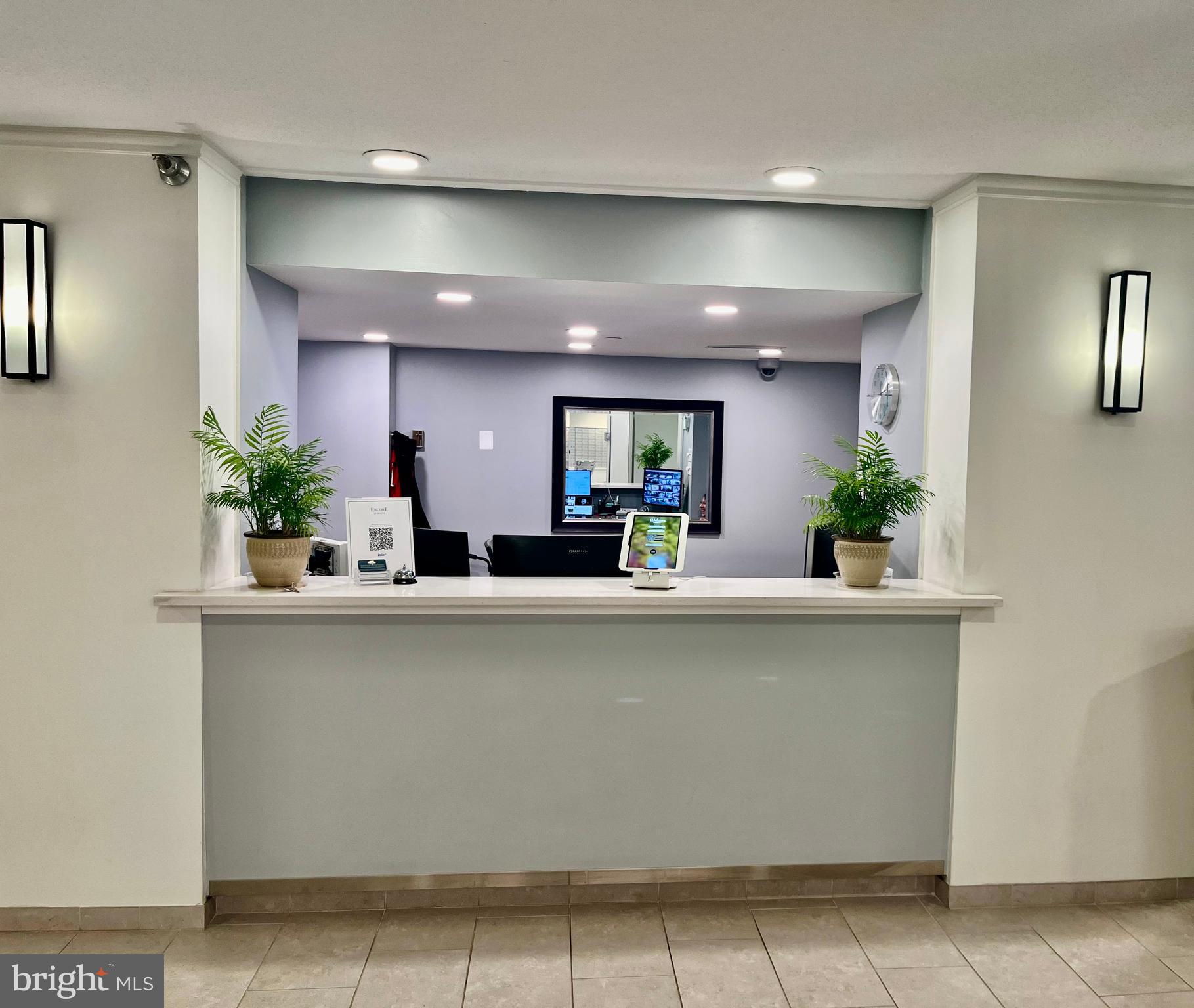 1808 Old Meadow Road, Unit 1104 McLean, VA 22102 - Photo 6 of 35 a view of kitchen with cabinets and potted plant