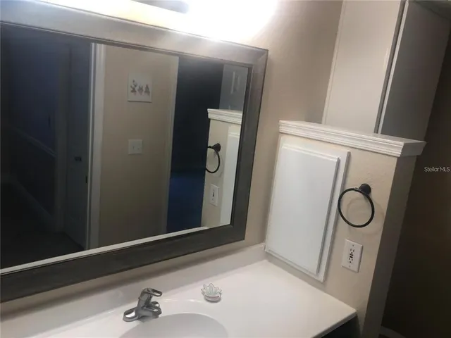 a couple of cars parked in front of a house