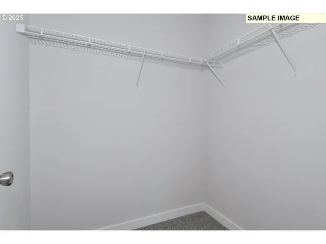 a view of an empty walk in closet