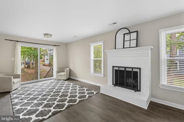 a bedroom with a bed and a fireplace