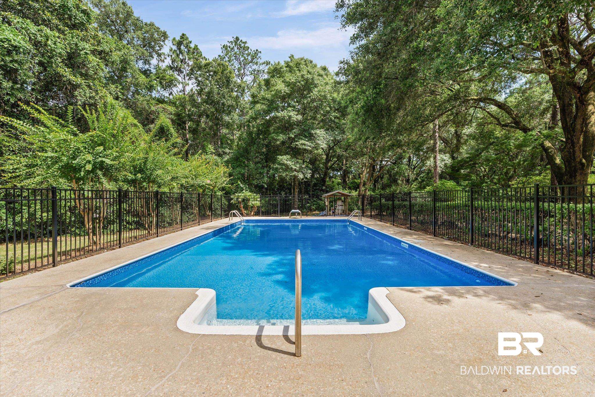 8301 Fordham Road Mobile, AL 36619 - Photo 32 of 57 Rectangular in-ground swimming pool featuring a light blue interior finish and white coping