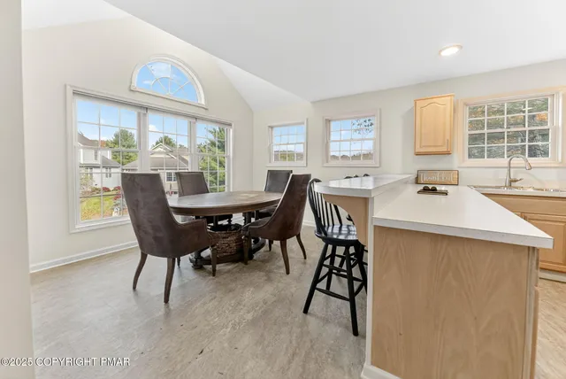 a dining room with furniture window wooden floor