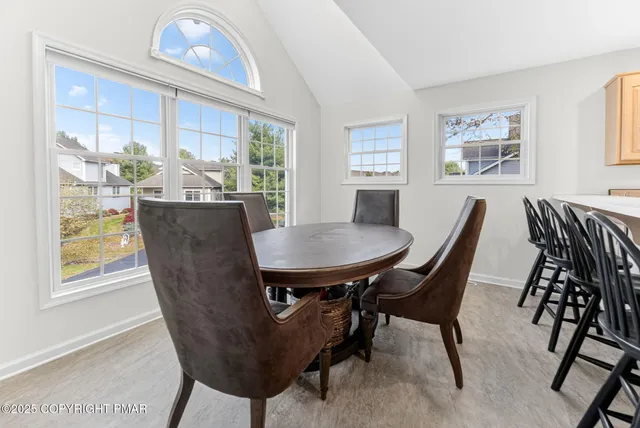 a view of a dining room with furniture window and outside view