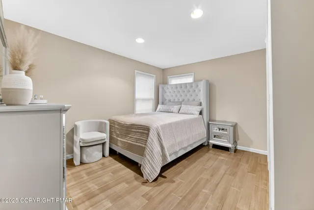 a bedroom with a bed and a table