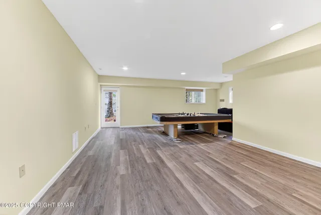 a view of room with furniture and wooden floor