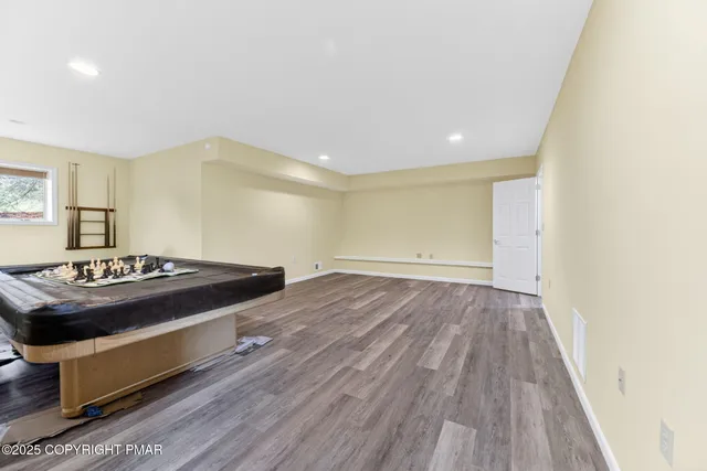 a bedroom with a bed and a table