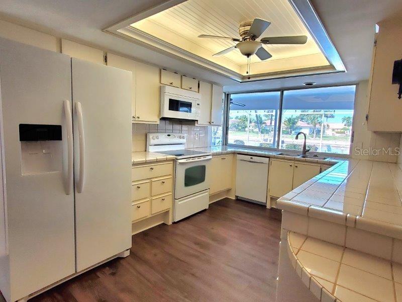 1450 Appian Drive Punta Gorda, FL 33950 - Photo 13 of 35 a kitchen with stainless steel appliances a stove a refrigerator and a microwave