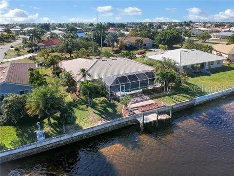 1450 Appian Drive Punta Gorda, FL 33950 - Photo 3 of 35 an aerial view of a house with swimming pool patio and outdoor seating