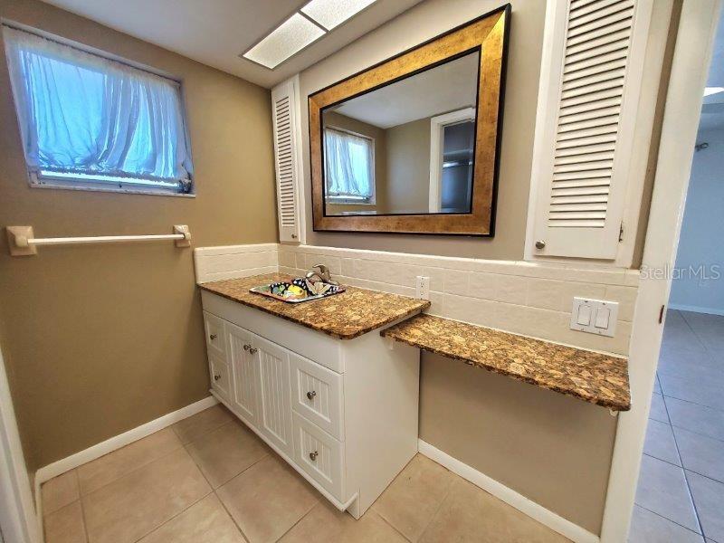 1450 Appian Drive Punta Gorda, FL 33950 - Photo 33 of 35 a bathroom with a sink and a mirror