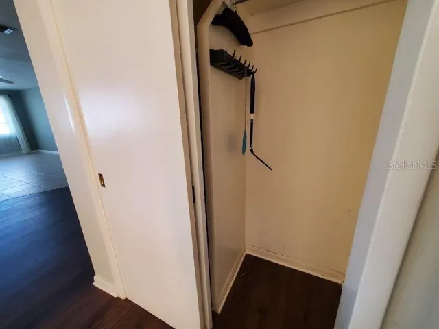 a view of hallway with wooden floor