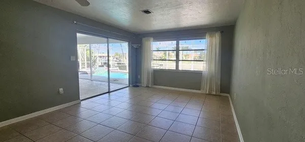 a view of an empty room and window