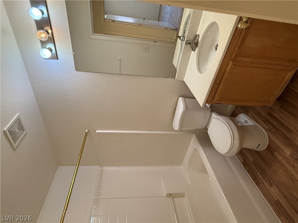 8108 Roundup Ridge Street Las Vegas, NV 89131 - Photo 11 of 21 A well-maintained bathroom offering a classic tub and shower combination with a vanity.