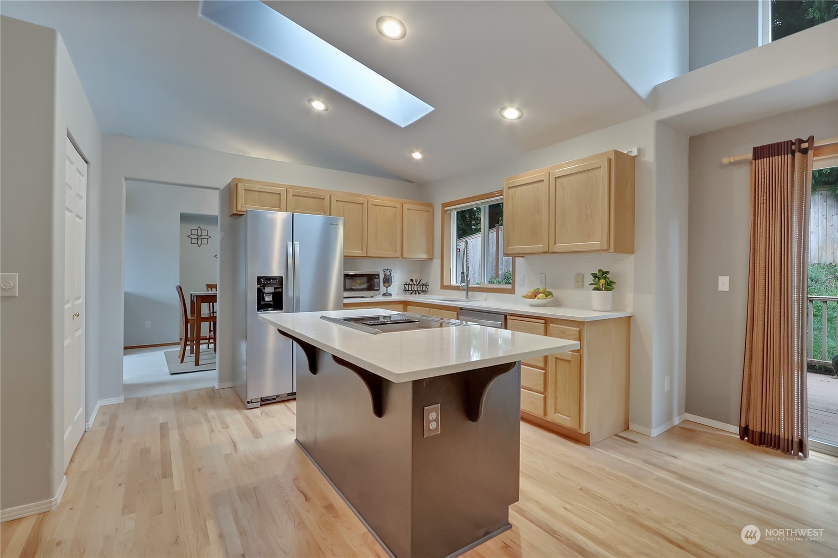 3430 201st Place Southeast Bothell, WA 98012 - Photo 11 of 32 a kitchen with stainless steel appliances kitchen island a sink stove and refrigerator