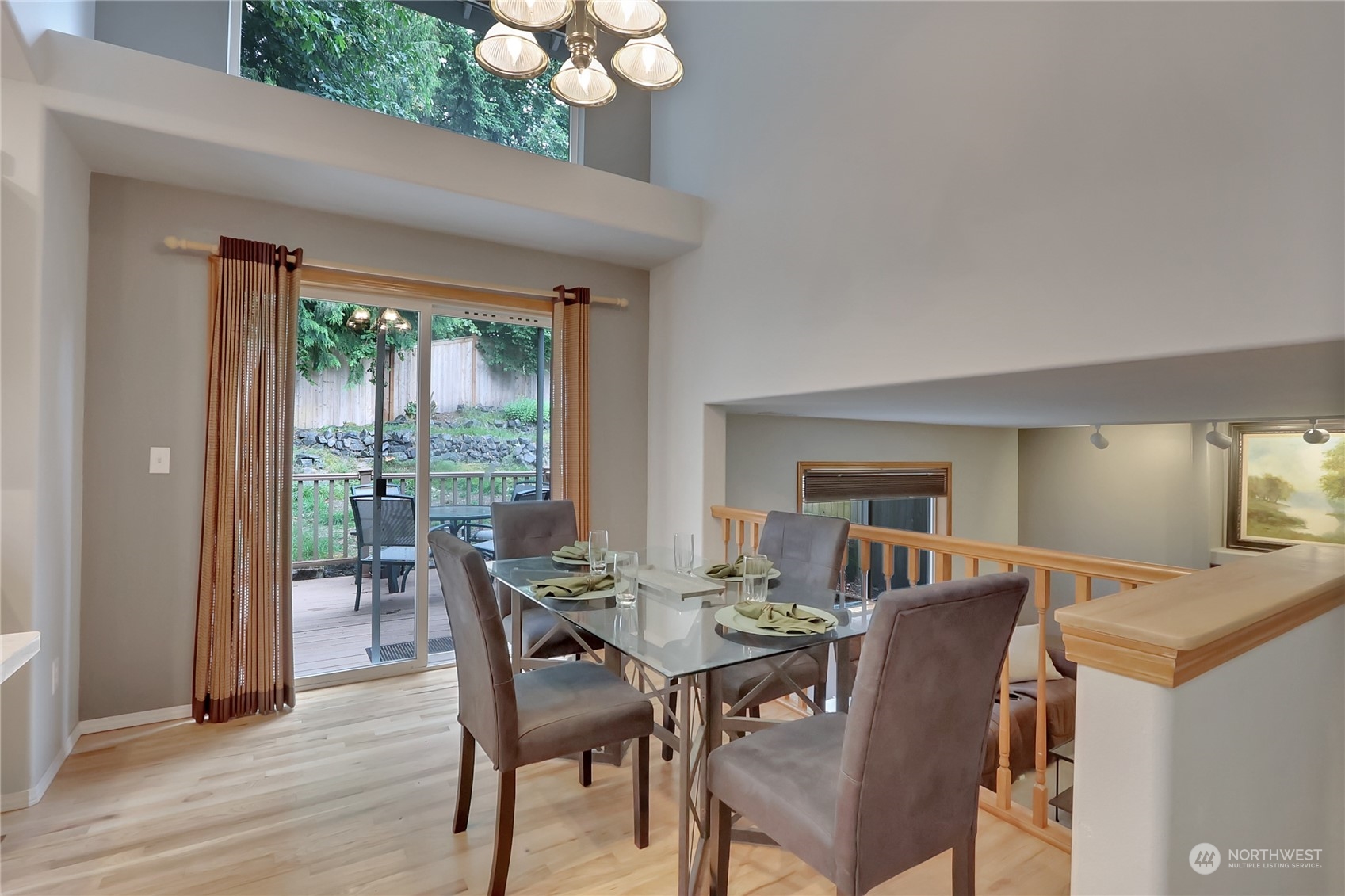 3430 201st Place Southeast Bothell, WA 98012 - Photo 13 of 32 a view of a dining room with furniture window and wooden floor