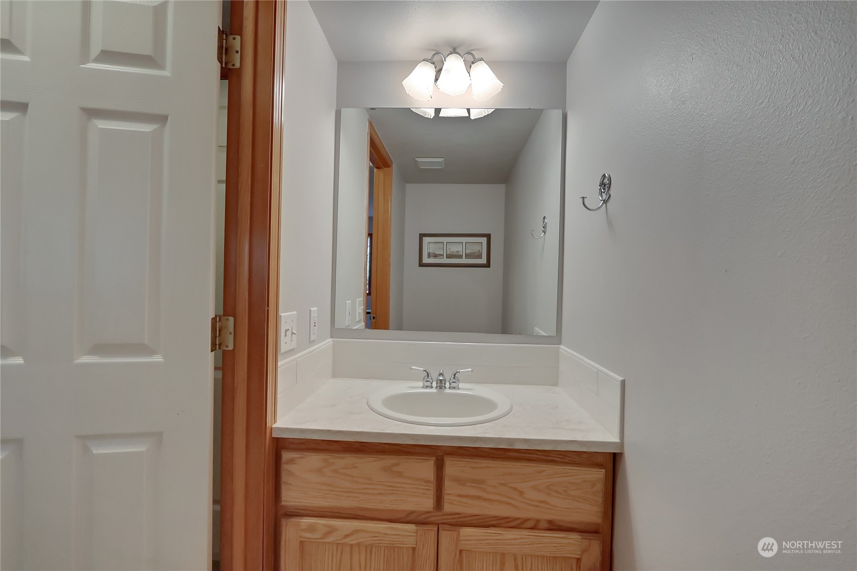 3430 201st Place Southeast Bothell, WA 98012 - Photo 16 of 32 a bathroom with a sink a light fixture and a mirror